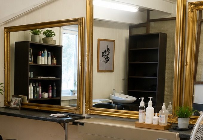 The styling station and gold-framed mirror at Anna's Quality Cuts